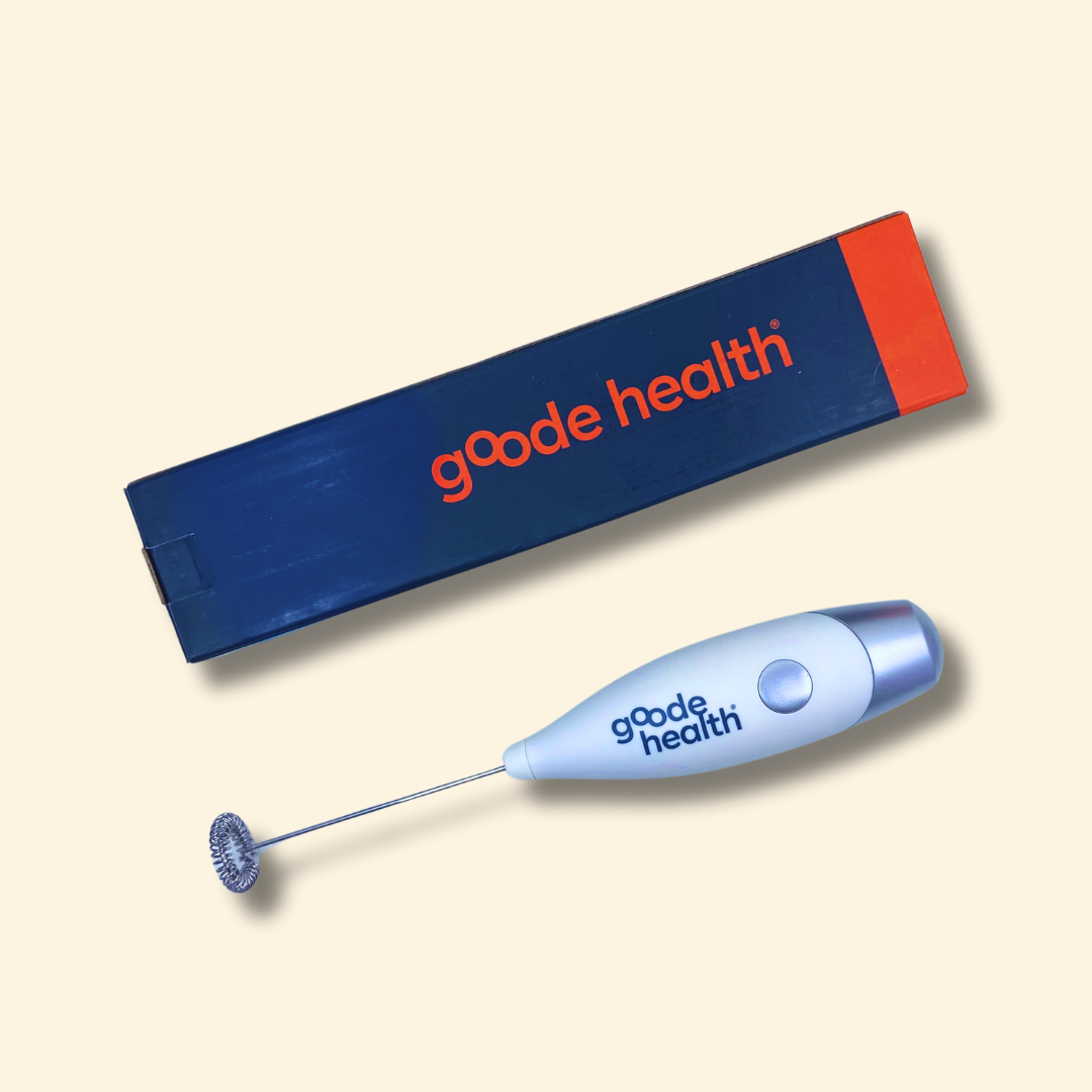 Blue 'gode health' milk frother with packaging on a beige background