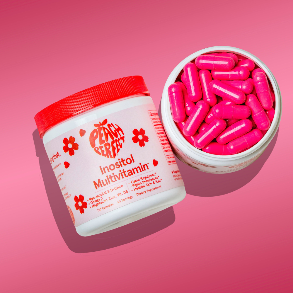 Peach Street Inositol Multivitamin container with pink capsules on a pink background