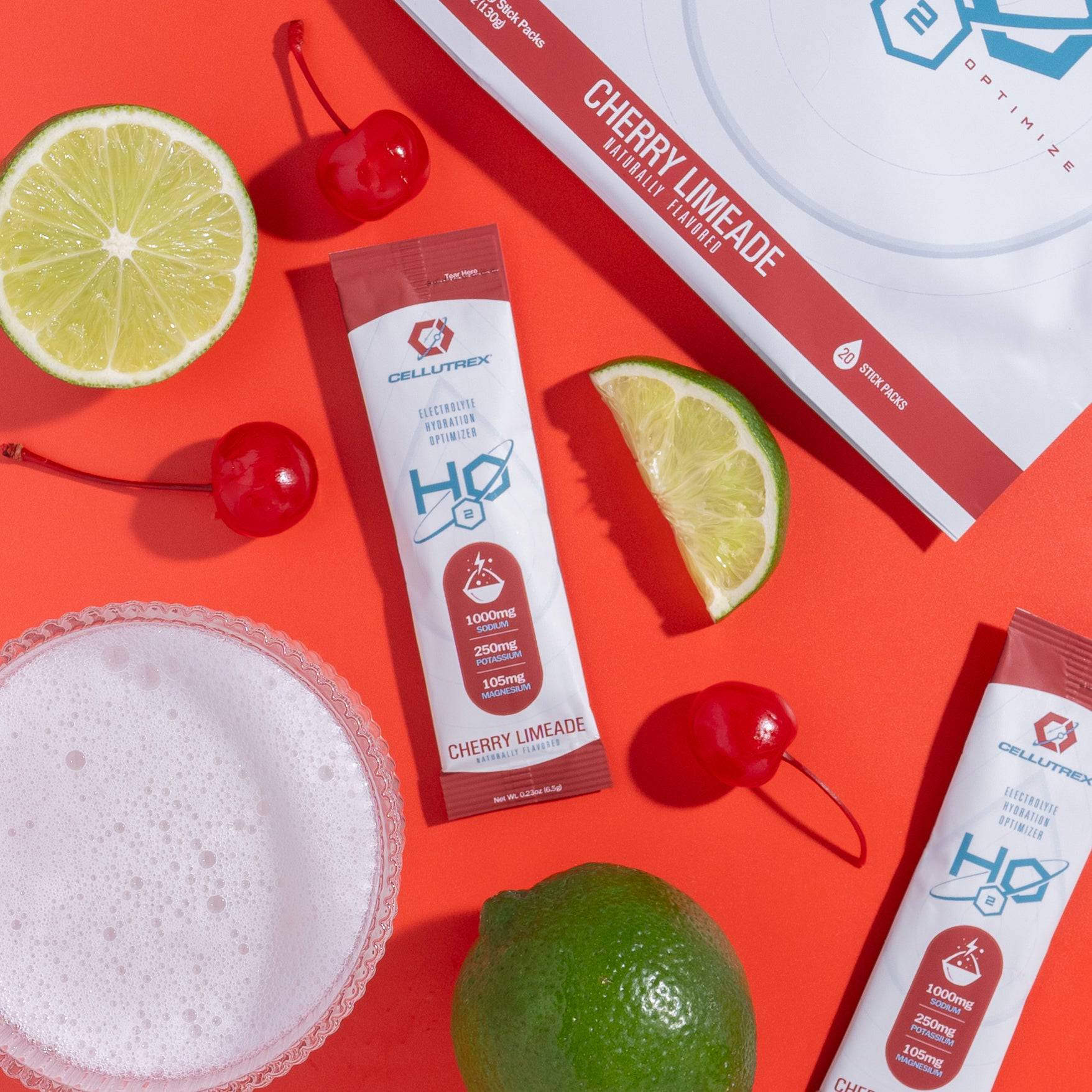 HO Cherry Limeade supplement packets with lime, cherry, and salt on a red background
