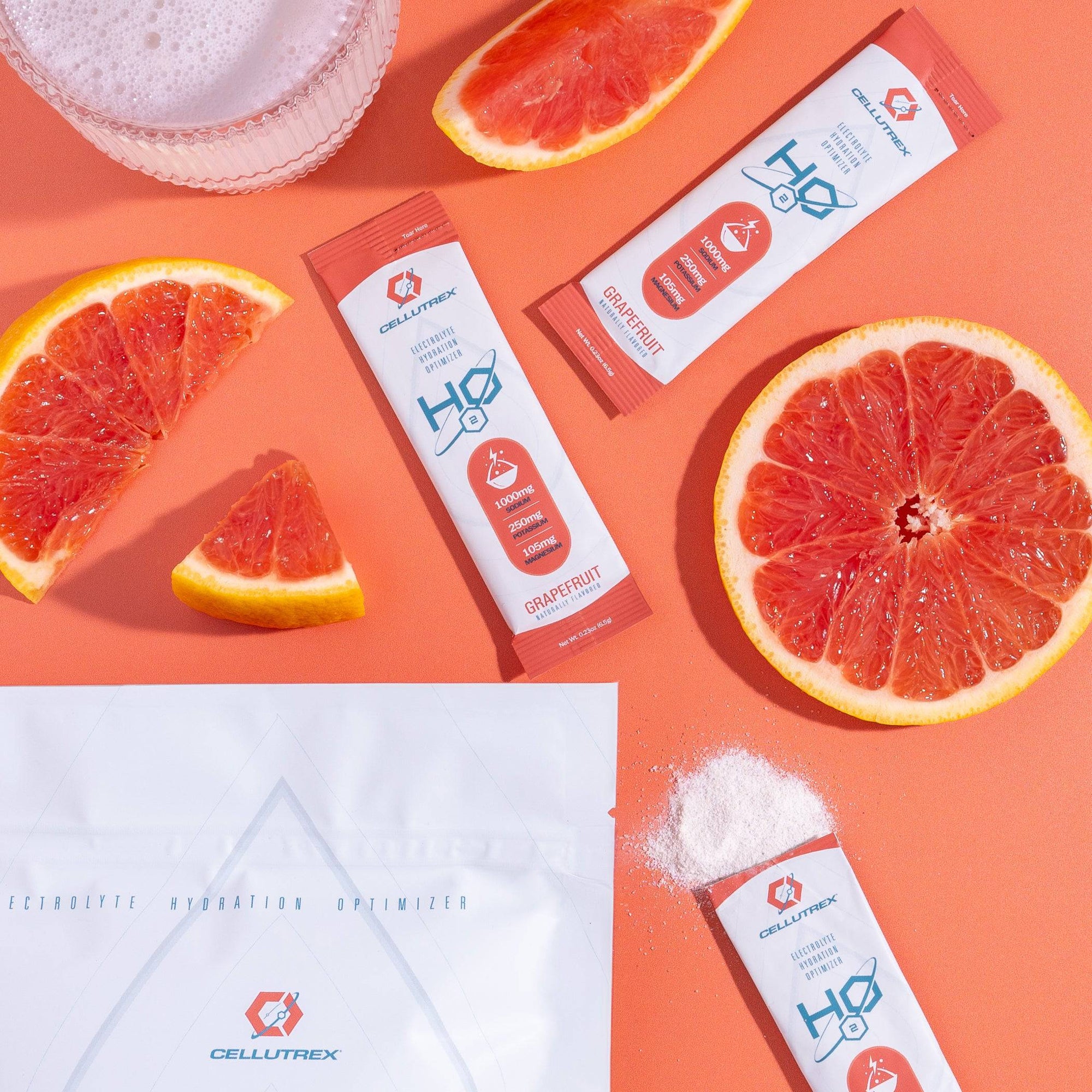 Cellutrex H2O Grapefruit drink mix packets with grapefruit slices on an orange background