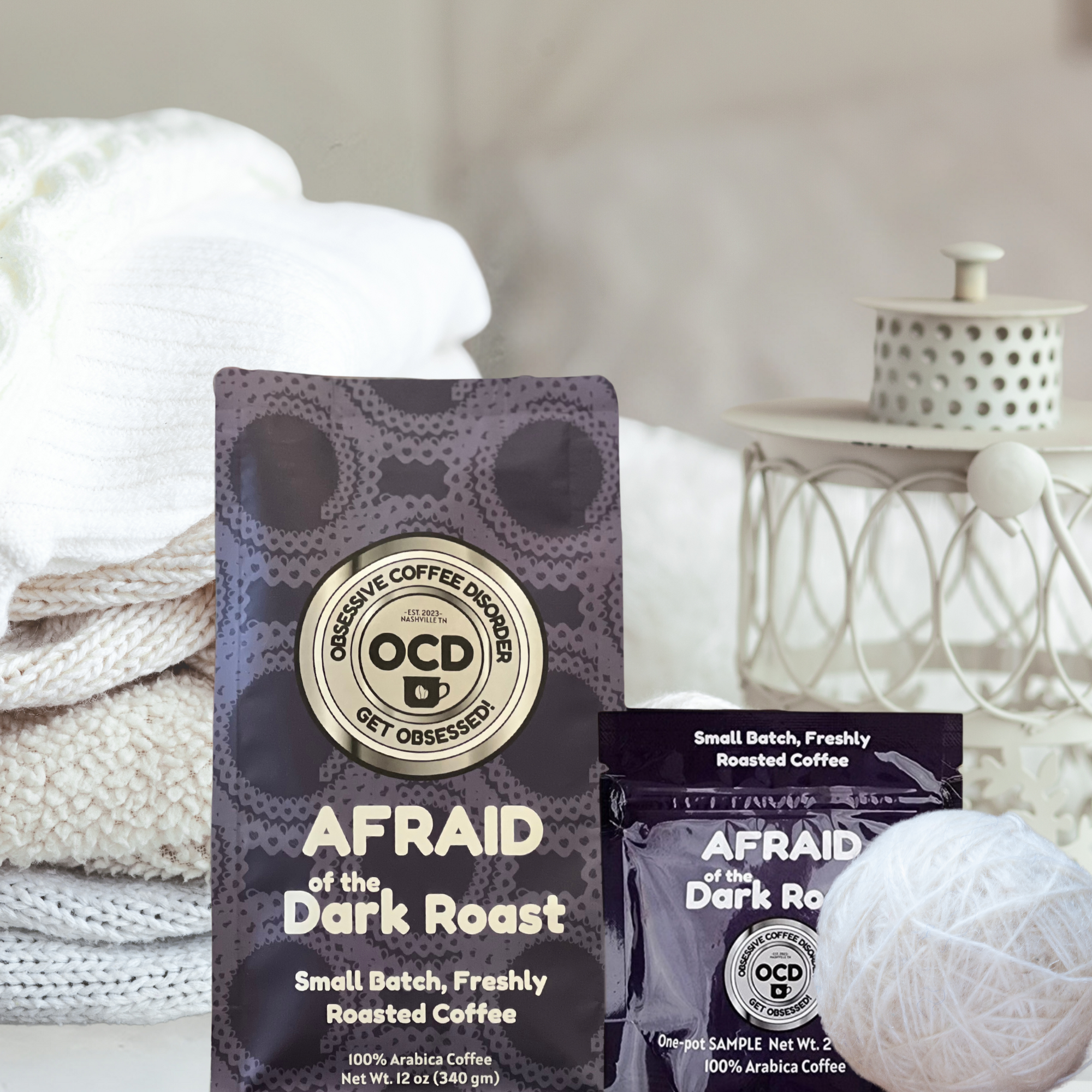 Coffee package labeled 'AFRAID of the Dark Roast' by OCD Coffee on a soft white background.