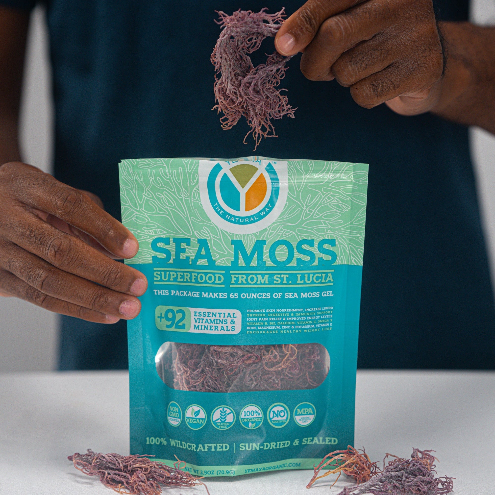 Packaging of sea moss with visible branding and product details on a neutral background