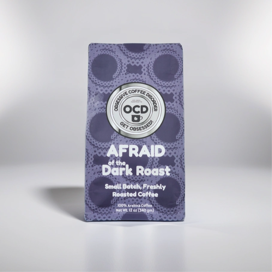 Coffee package labeled 'OCD Coffee' with 'Afraid of the Dark Roast' on a gray background