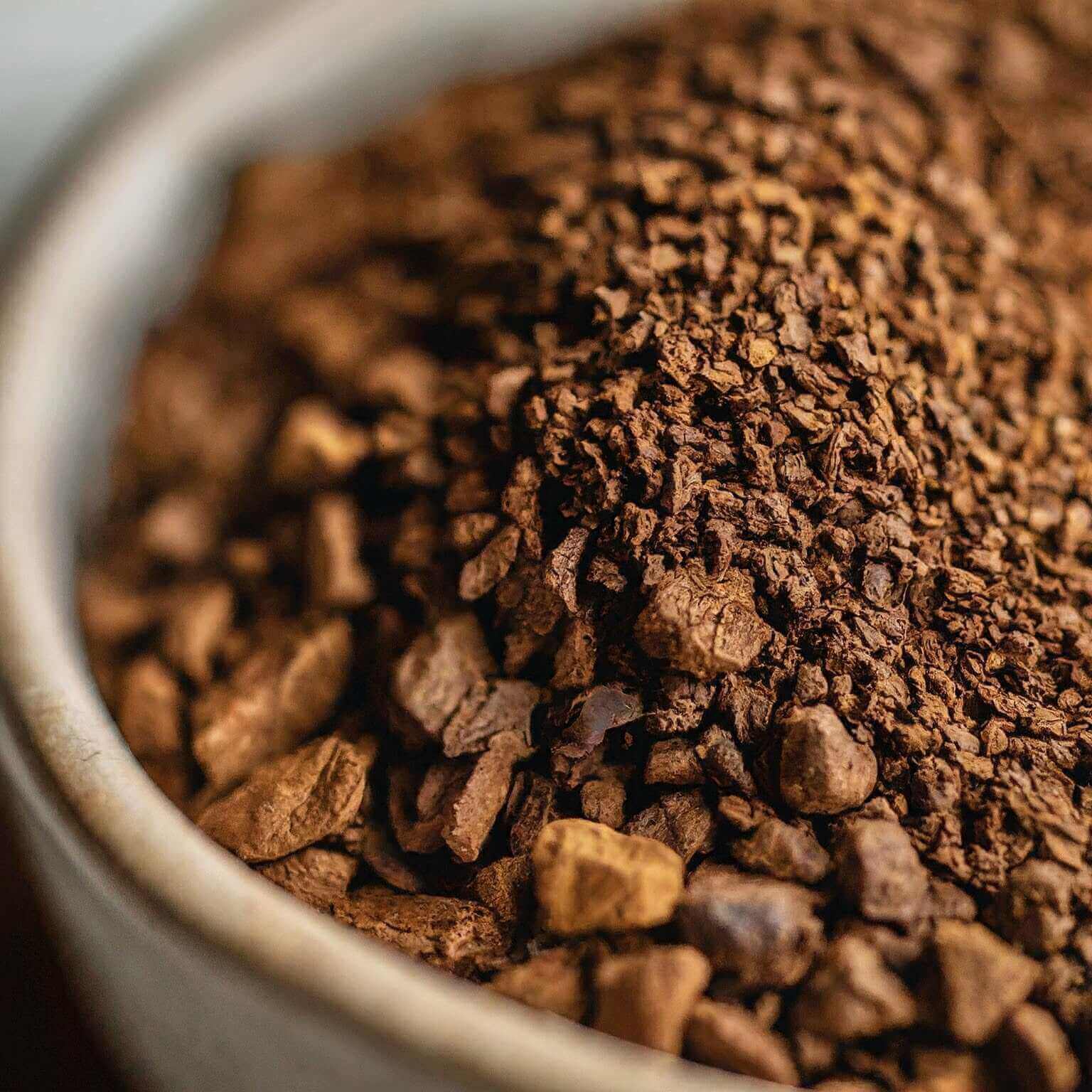 Close-up of ground coffee beans in a container