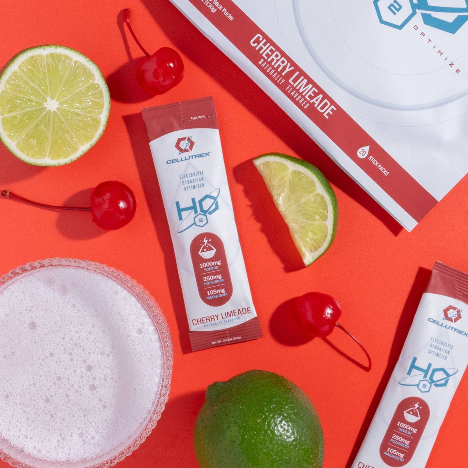 Two packets of Cellucor Cor-Performance HD on a red background with cherries and limes.