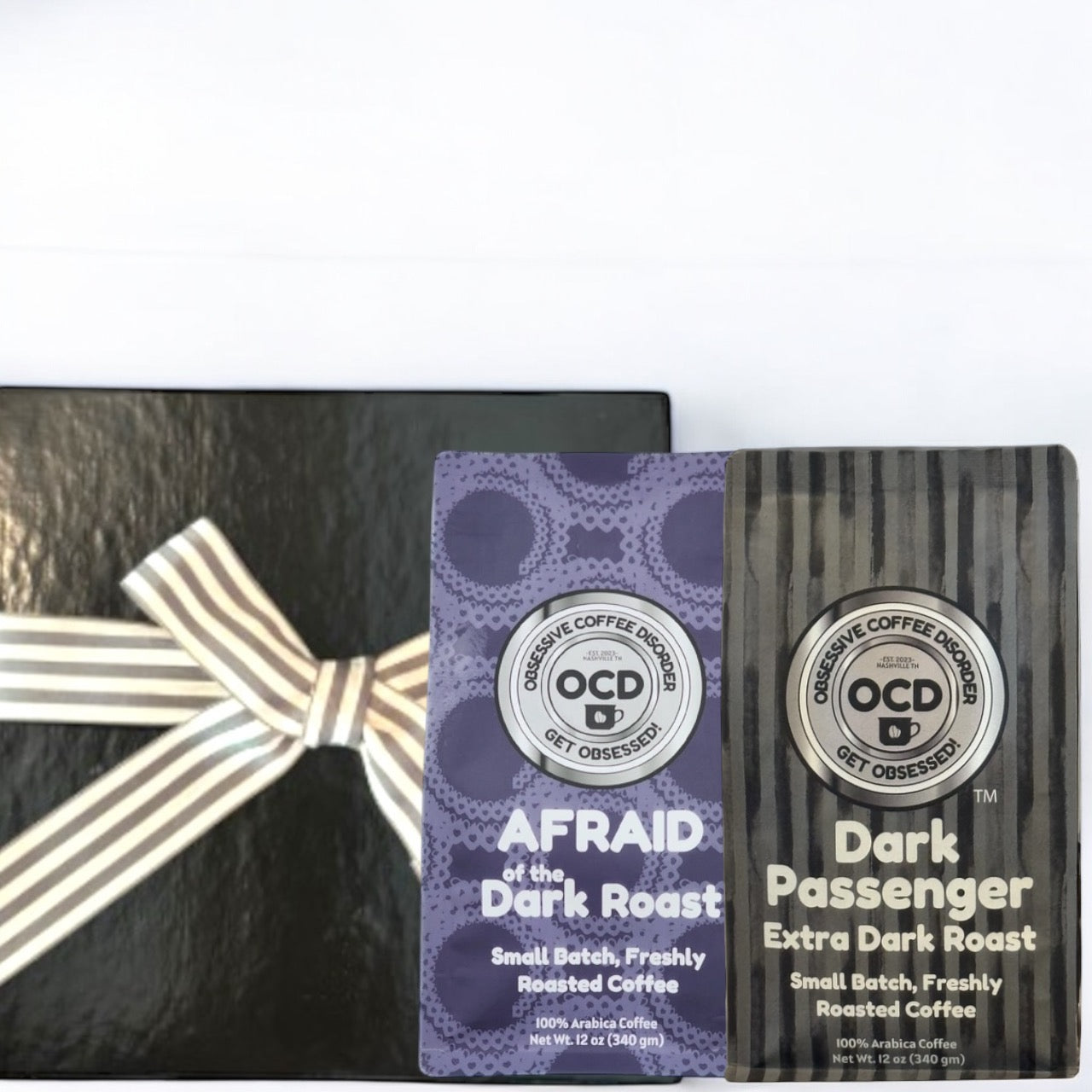 Two coffee packages with decorative ribbons on a white background