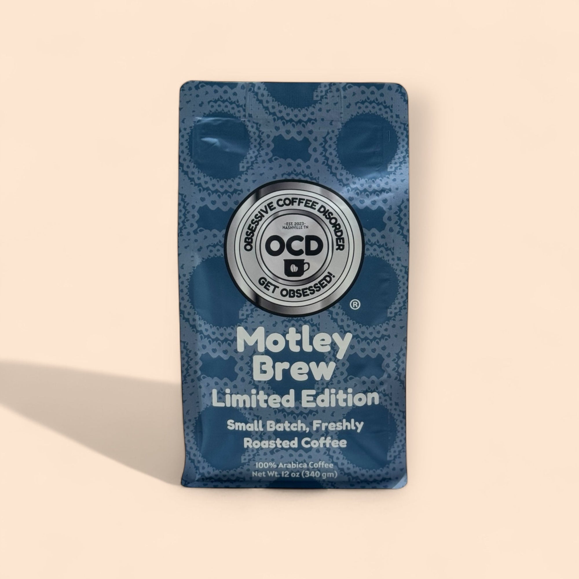Coffee package labeled 'Motley Brew' with OCD Coffee Disorder branding on a beige background