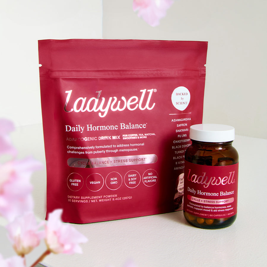 Ladywell Daily Hormone Balance package and bottle on a light background with pink flowers.