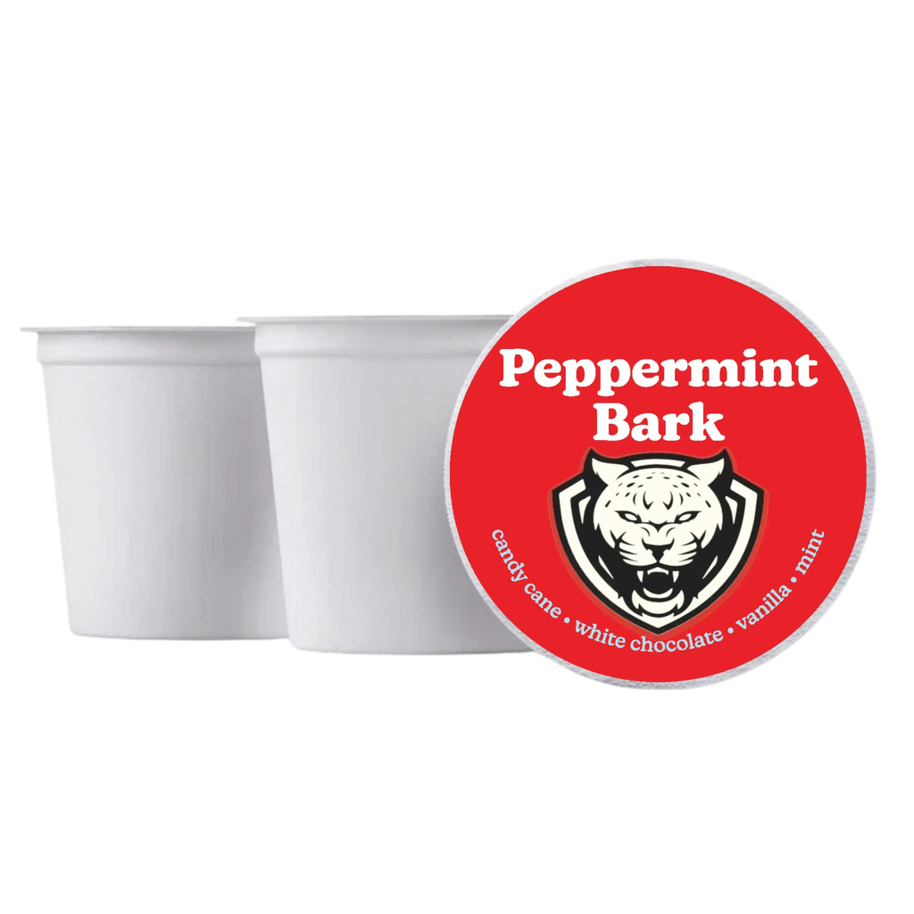 Two white containers with a red 'Peppermint Bark' label featuring a tiger design on a white background.