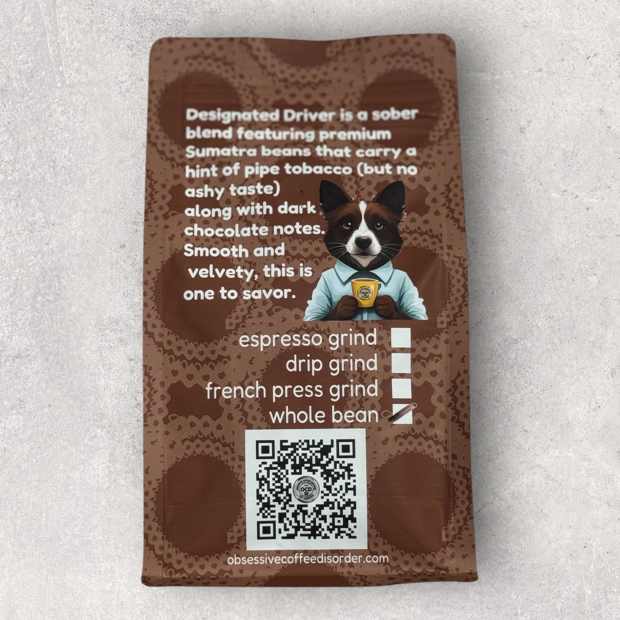 Coffee package with a dog illustration and text on a textured surface