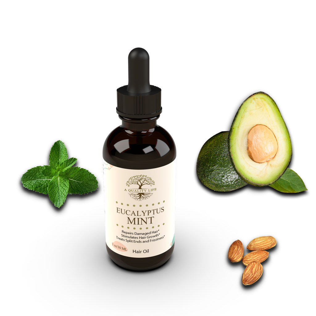 Bottle of Eucalyptus Mint hair oil with avocado, almonds, and mint leaves on a white background
