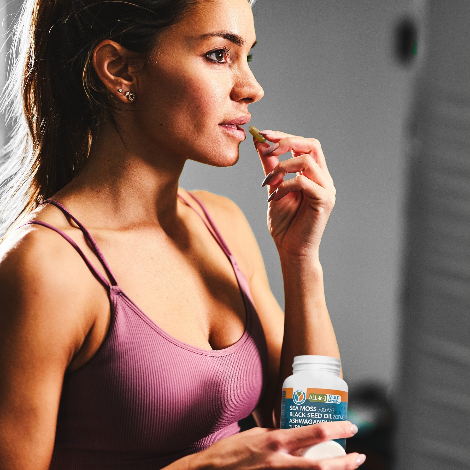 Woman applying lip balm with a blurred background