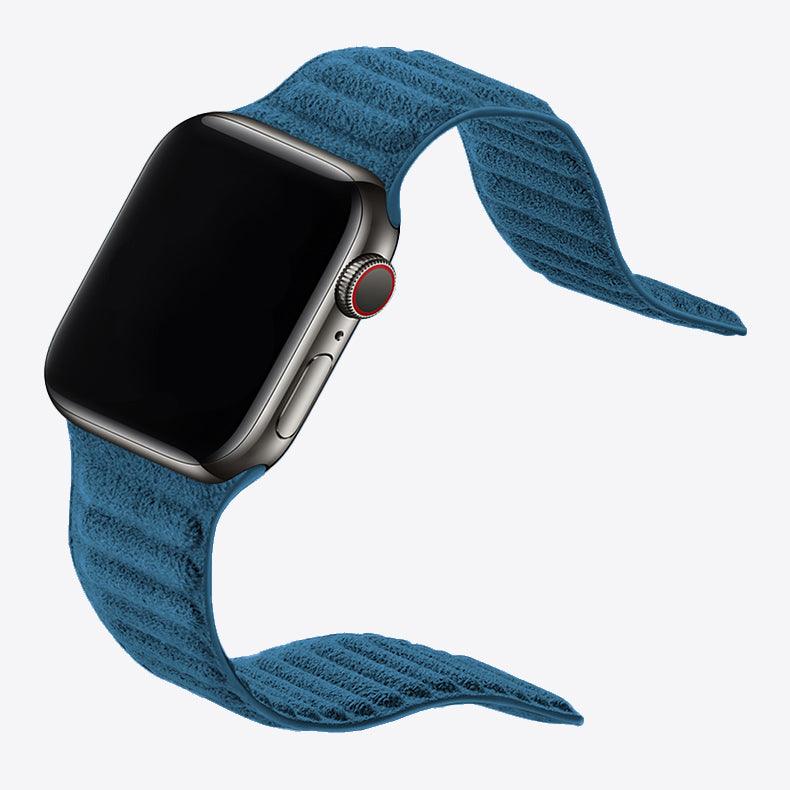 Smartwatch with a blue textured band on a white background