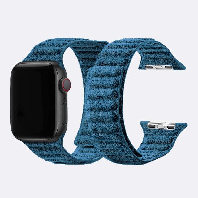 Blue textured watch band on a white background